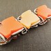 1960s lucite large leaf orange bracelet. SMOLDERING HUES.