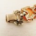 1960s lucite large leaf orange bracelet. SMOLDERING HUES.