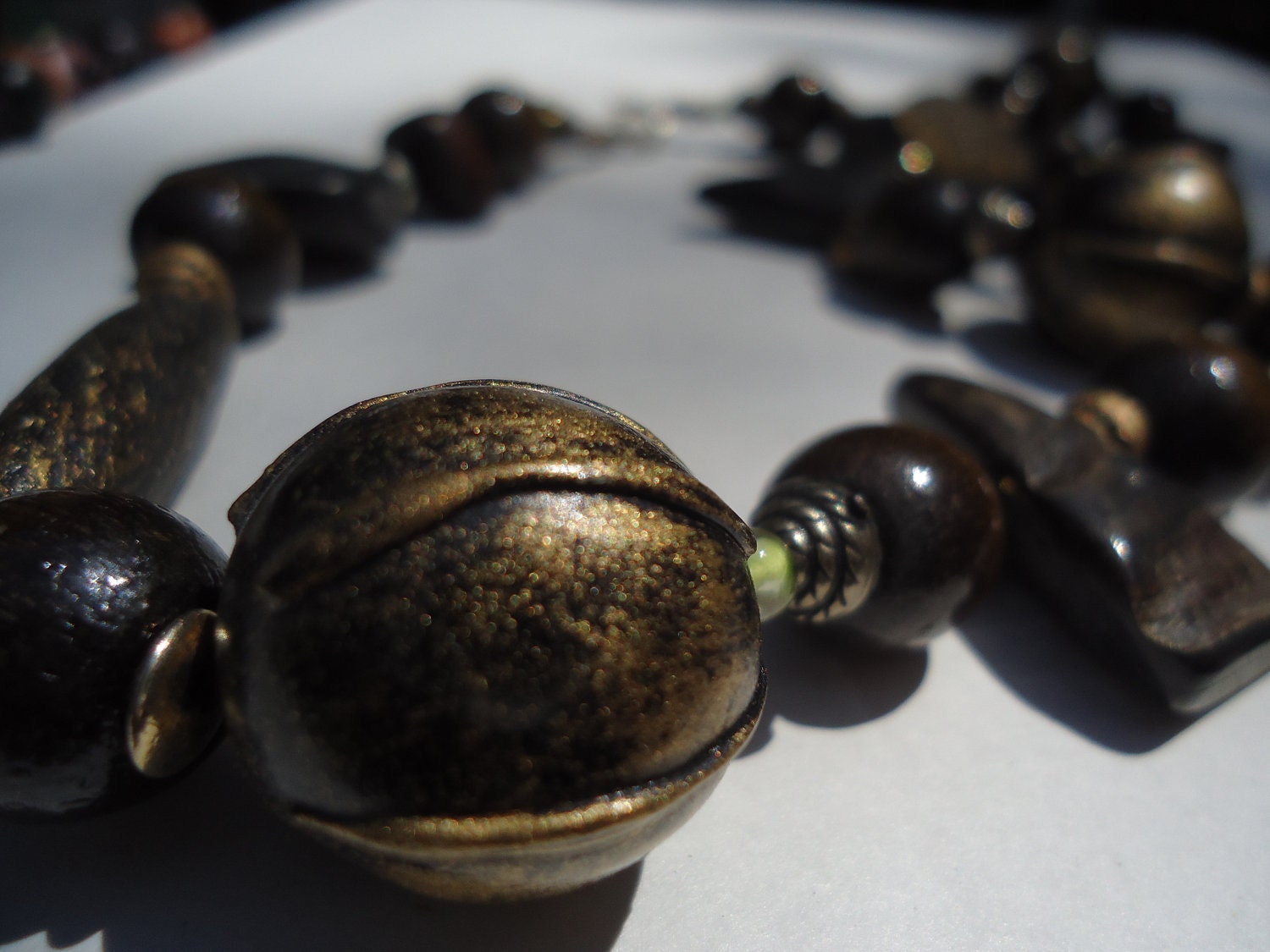 Vintage wood and seed pod necklace accented with gold paint