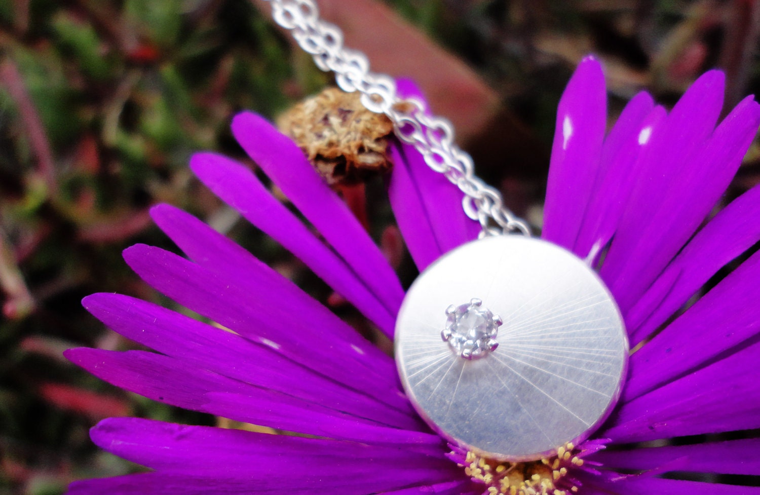 Single Starburst Circular Silver Necklace