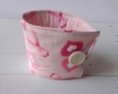 Fabric Coffee Cozy in Pink Ribbon With Hearts on Pink Background