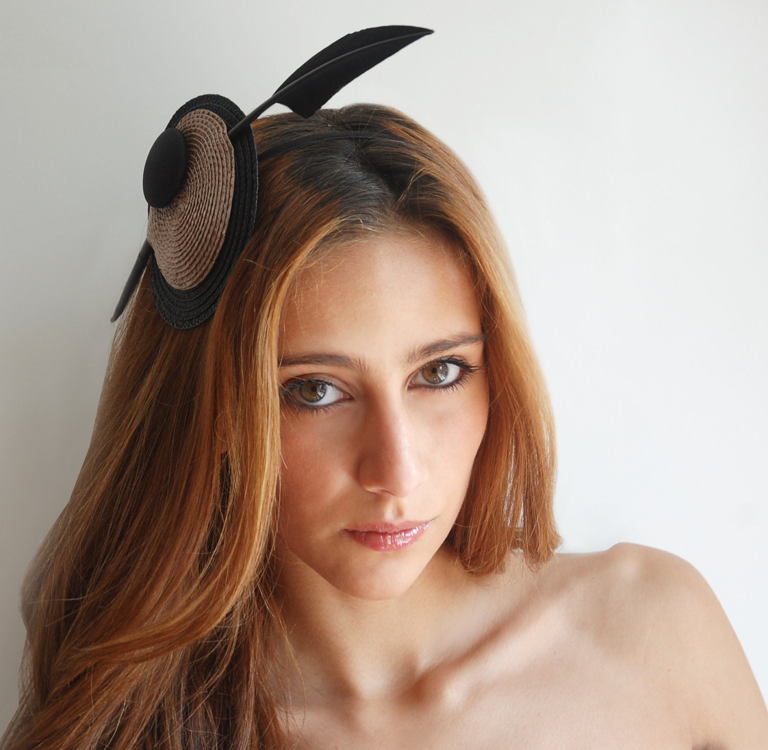 black  straw fascinator with arrowhead quill for women