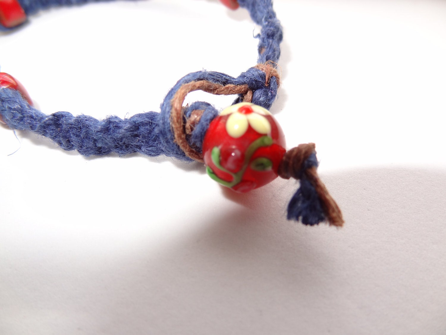 7 Inch Deep Blue Hemp Bracelet with Red Cube Beads and Flower Bead Loop Clasp