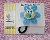 Ponytail Holder:  Boutique Styled Felt Ponytail Holder embellished with Blue and Yellow Owl Button