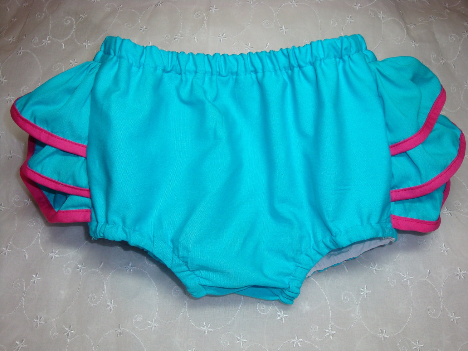 Little MISS ISABELLE Sassy, Fluffy Turquoise Aqua Ruffle Diaper Cover Bloomers Trimmed in Hot Pink Bias Edging by Bloomin Cuties