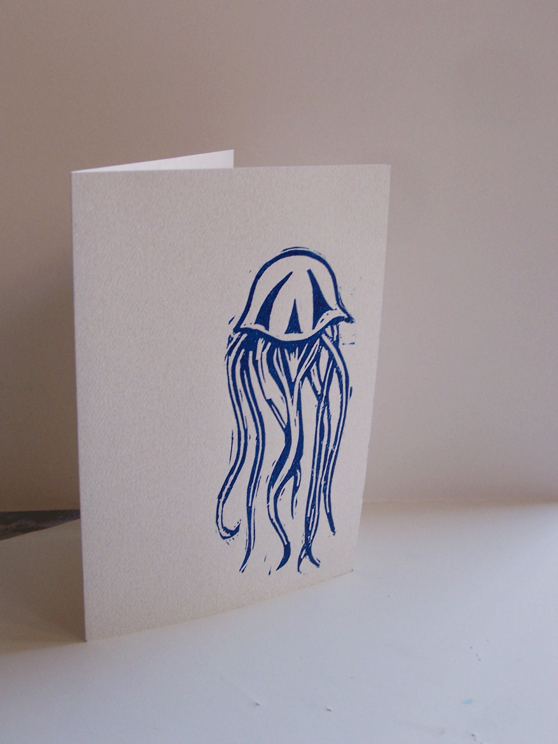 Blue Jellyfish blank greeting card. Hand drawn and printed linocut jellyfish greeting card