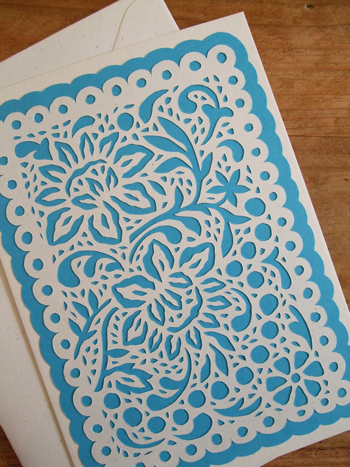 Small: Floral lace pattern with bright blue background