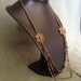 Reserved long necklace in vintage bronze with bronze , bleu and grey beads