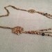 Reserved long necklace in vintage bronze with bronze , bleu and grey beads