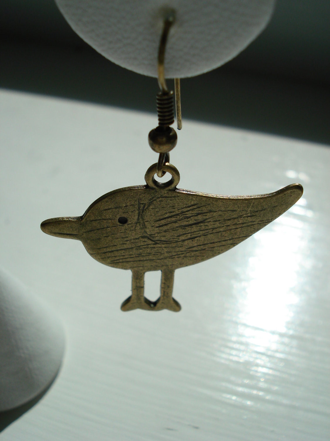 Antiqued gold tone bird earrings