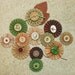12 nature inspired green and brown rosettes with embellishments
