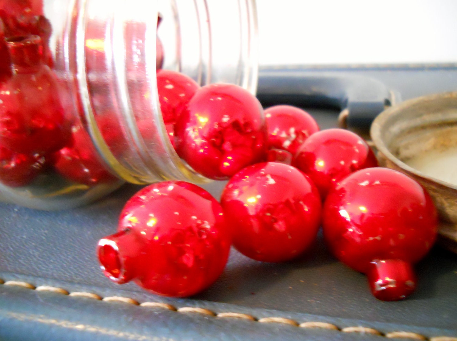 can it - Atlas canning jar filled with red glass bulbs
