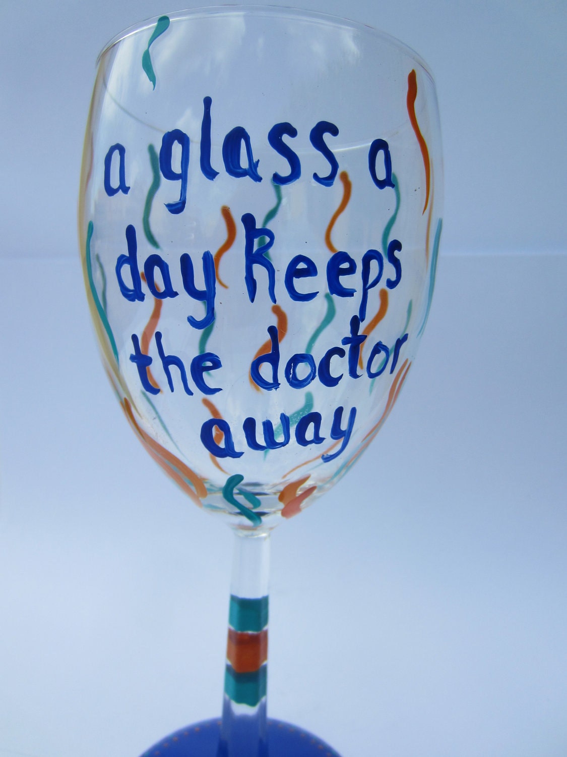 hand painted wine glass "a glass a day keeps the doctor away"
