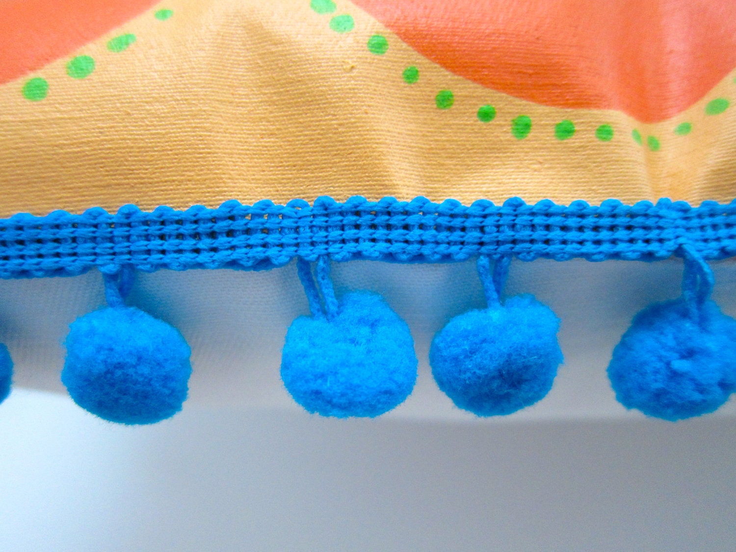 Baby pillow in orange and bright green. Personalized with name.
