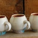 the perfect white and turquoise egg- shaped mug