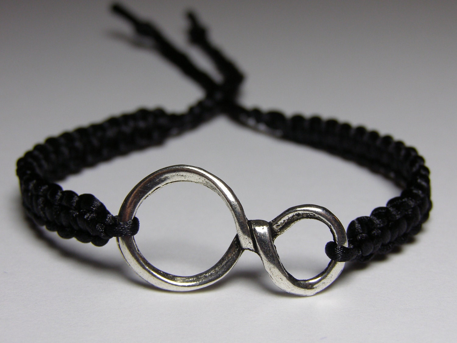 Infinity Bracelet with black nylon thread