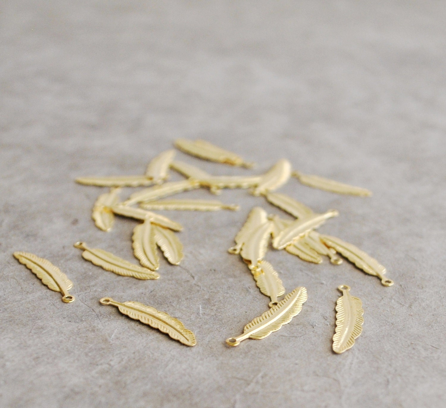 tiny gold finish cast feather pendants (10 pcs)