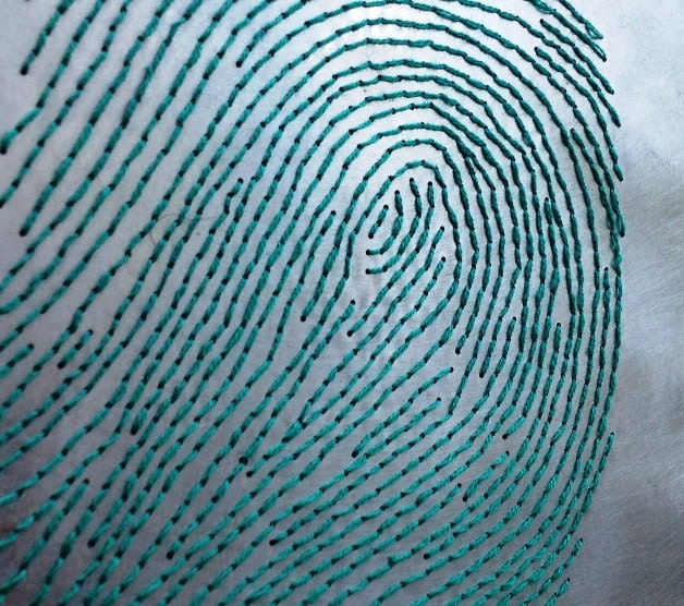 Fingerprint aluminum and wood embroidery
