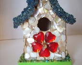 small embellished birdhouse