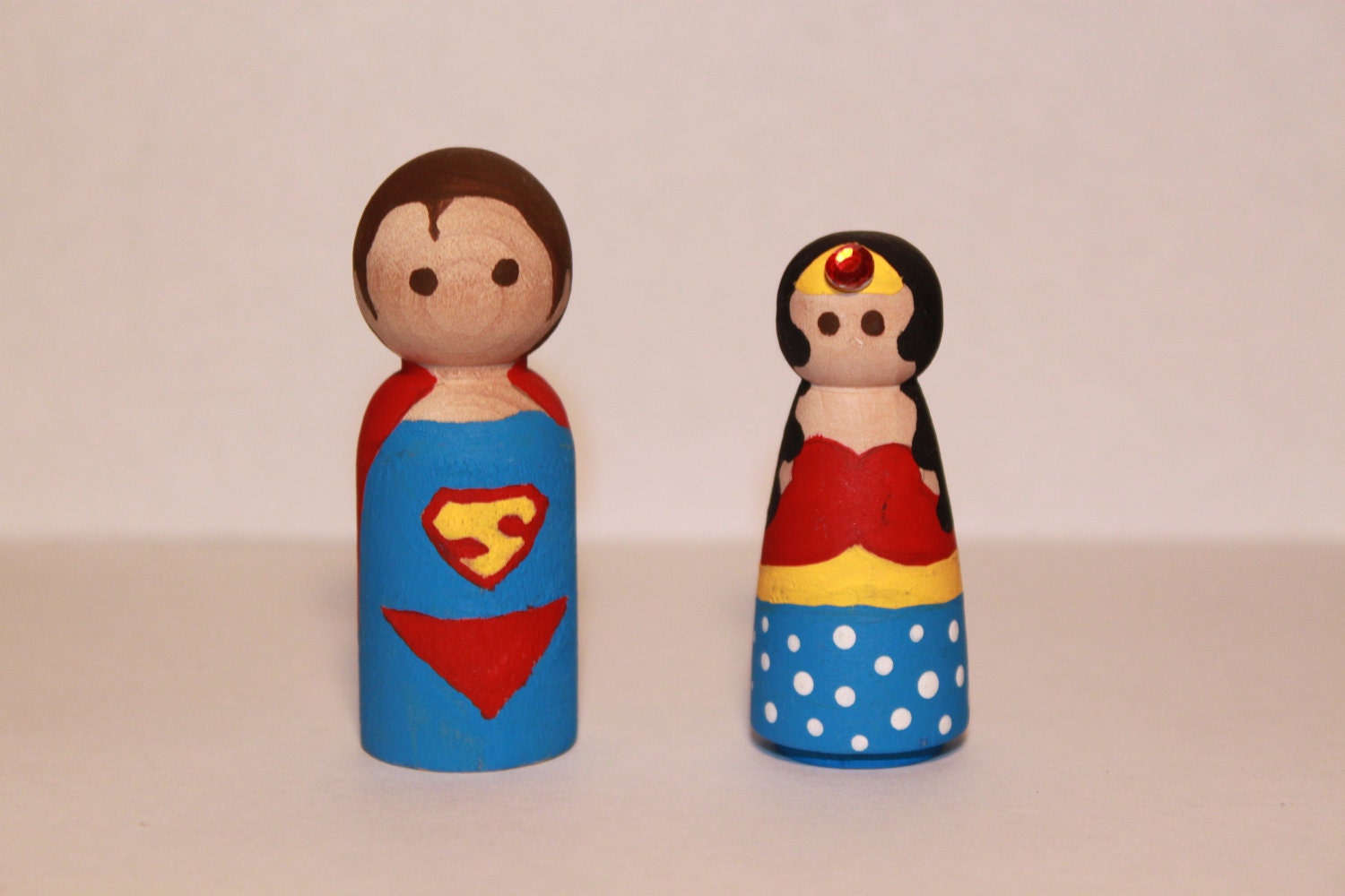 Superman and Wonder Woman Peg Dolls