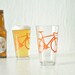 4 bike pint glasses, orange bicycle rocks glassware