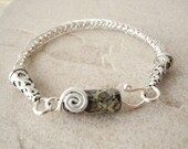 Fish tail braided wire bracelet-sterling silver with lampwork S clasp. Earth Day. Neutral colors