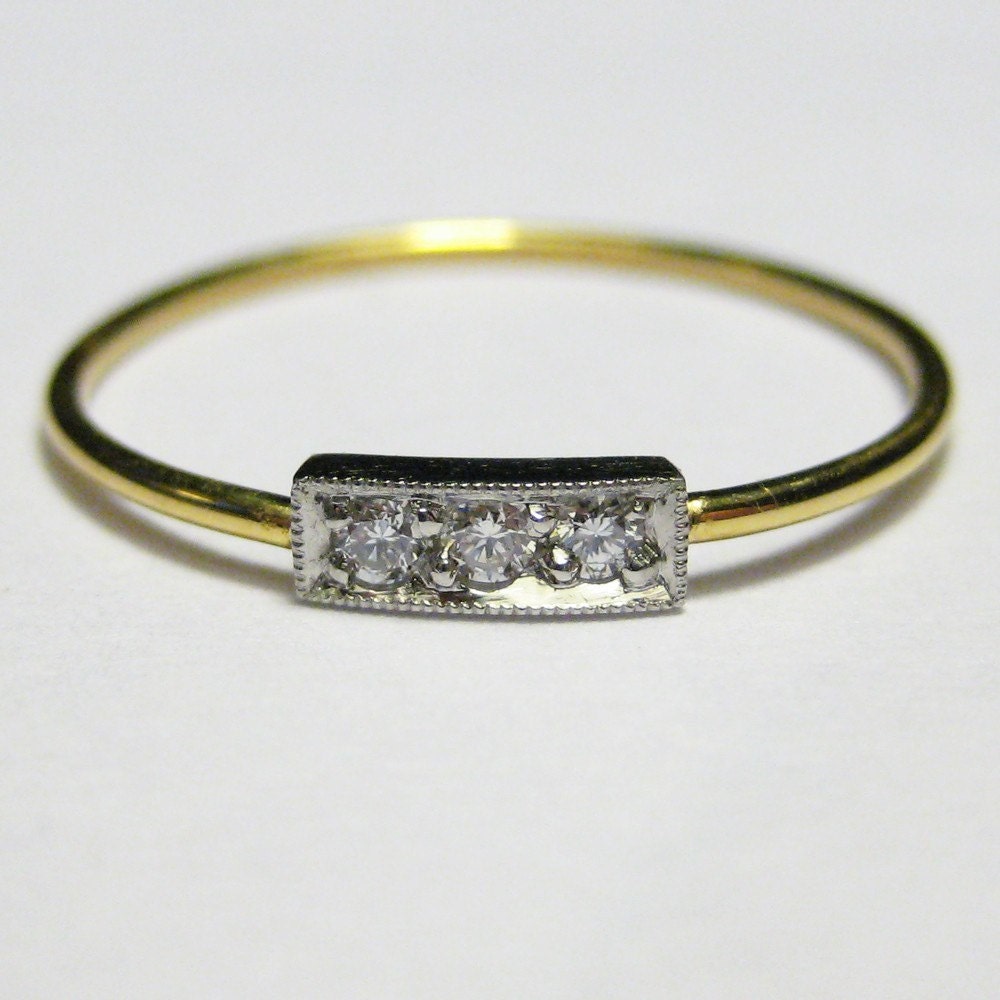 Svea, a Platinum, 22K Gold and Diamond Ring