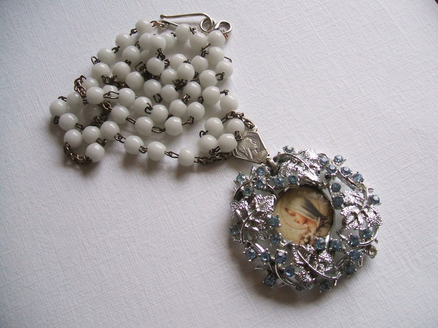 White milk glass  silver and blue rhinestone Mary rosary reliquary necklace