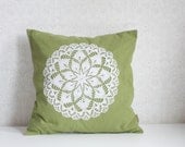 green decorative pillow cover with white vintage lace