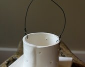 Ceramic and wire tea light candle holder with wire handle