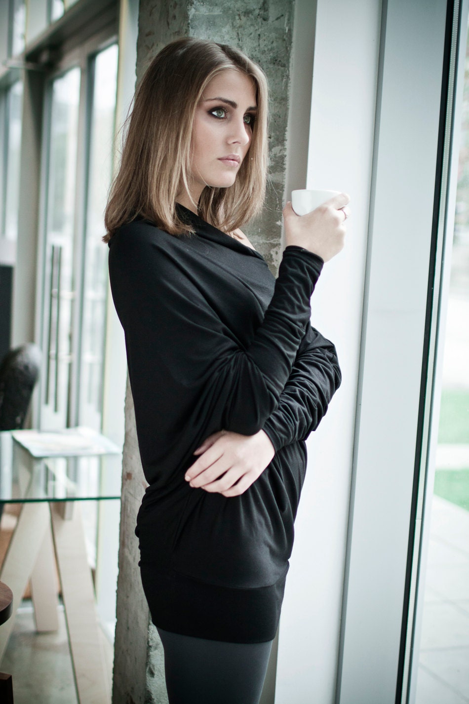 Black asymmetric long-sleeved  Muse blouse with buttons on the back