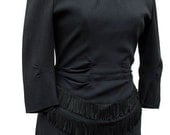 Black crepe mid 1940s dress with tartan trim and fringed peplum