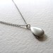 Sterling silver puffy teardrop locket on antiqued silver chain, upcycled vintage piece