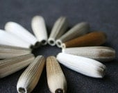 Delicate vintage silky teardrop beads. Cafe au lait shades.