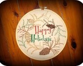 Christmas Cones: Pine Cones and Holiday Text Hand Embroidery Patterns in PDF format.