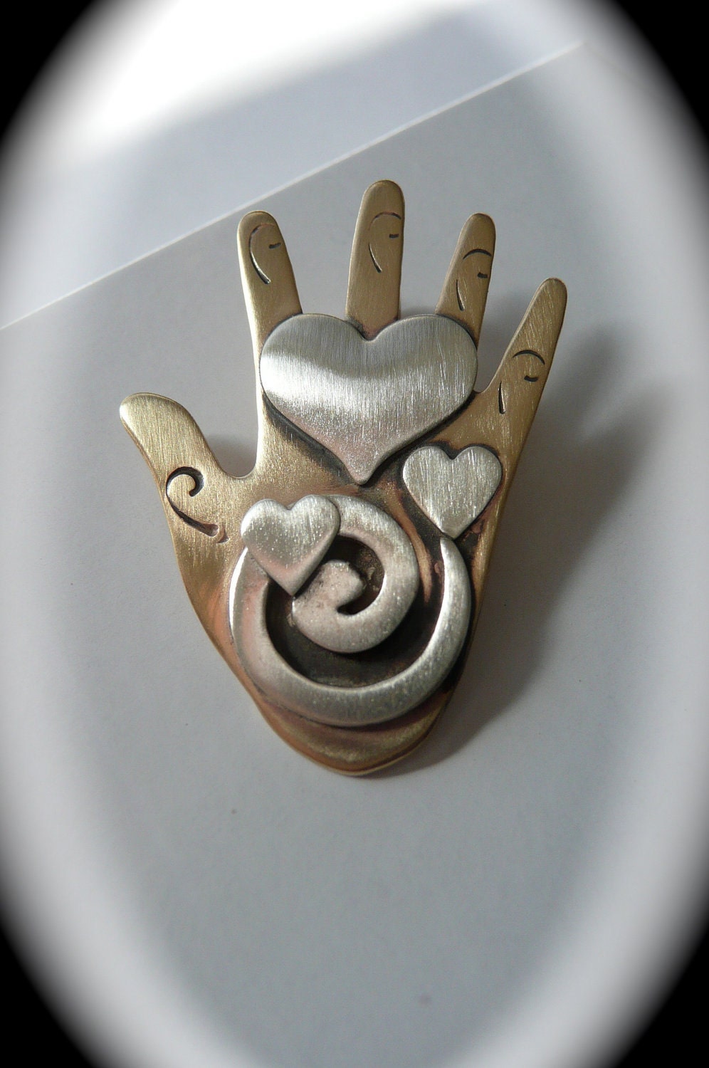 heart , hand ,  love, pin handmade ,  sterling and bronze , valentines , spiral , spirit jewelry