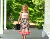 Pink, black, and ivory floral girls maxi dress with ruffles. Embellished with silver vines and leaves.