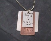 Hand Stamped necklace - "A moms heart is a patch work of love"
