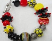 Beaded Lampwork Bracelet in Black, Red, and Yellow