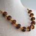Necklace made of lampwork glass beads, vermeil with a vermeil chain and toggle