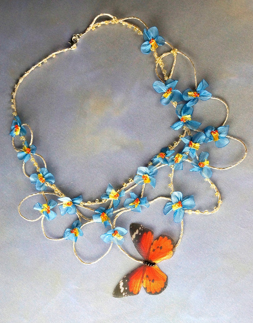 Statement linen necklace with forgetmenot and butterfly. Floral wearable art jewelry. Fairy wedding bijoux for spring bride.