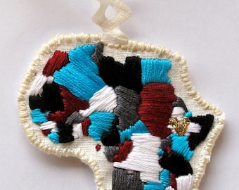 Ethiopia embroidered ornament in blues with gold heart