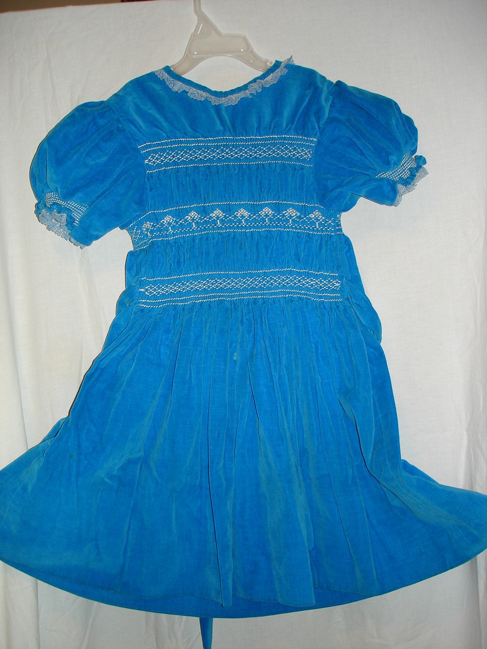 Girl's blue velvet dress with smocking
