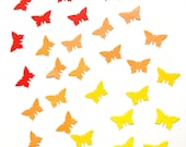 100 handpunched butterflies in the shades of yellow, orange and red
