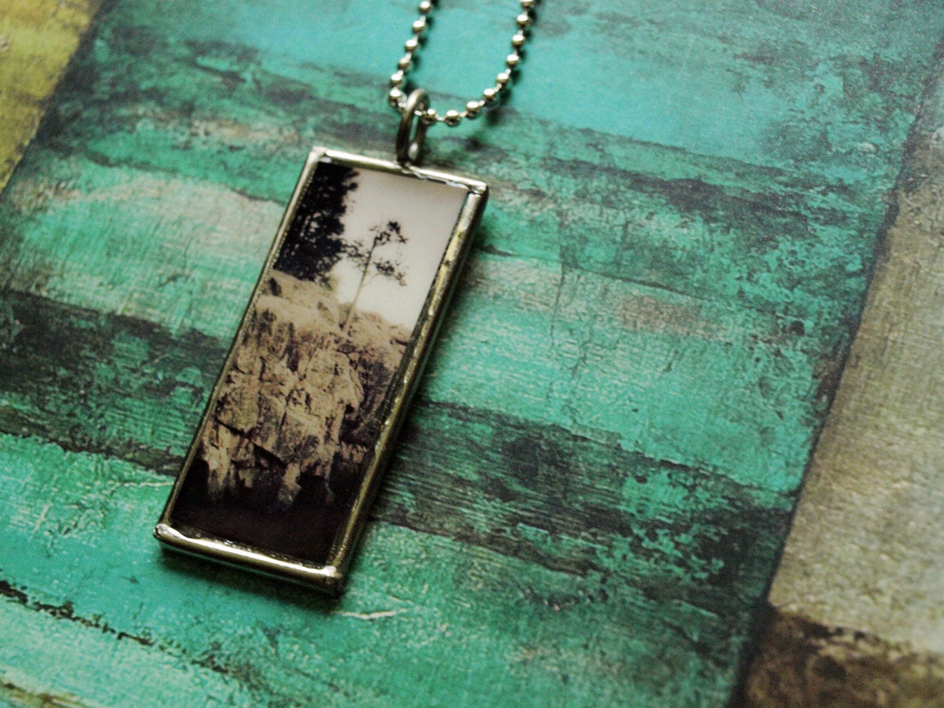 Overlook tree and rock pendant on framed glass- Music on reverse