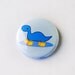 Blue Dinosaur Wearing Rain Boots or Galoshes Pinback Button: One Inch