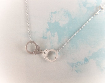 silver handcuff necklace with heart key