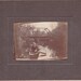 Cabinet Card Photo of Men Canoeing under a Bridge