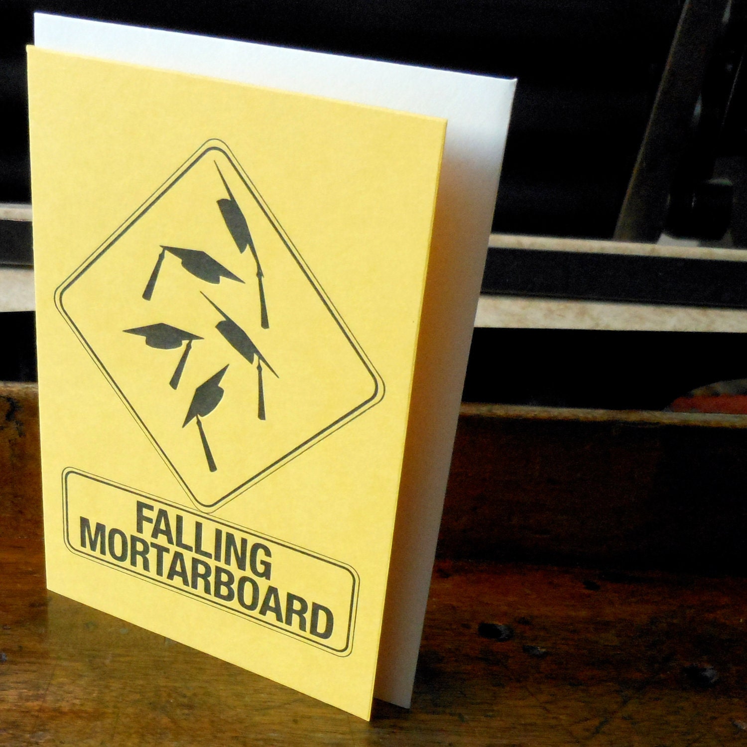 falling mortarboard