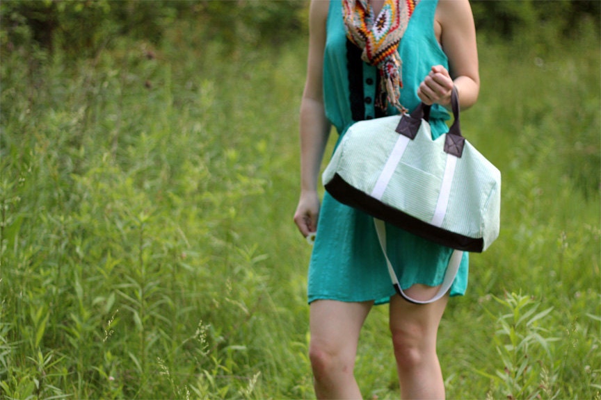 The Overnighter, a green duffle bag